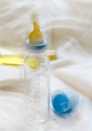 Baby bottle, blurred Stock Photo - Premium Royalty-Free, Code: 696-03398092