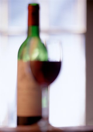 simsearch:640-02770391,k - Glass of wine and wine bottle, blurred Stock Photo - Premium Royalty-Free, Code: 696-03398127