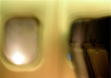 porthole - Window in airplane, blurred Stock Photo - Premium Royalty-Free, Code: 696-03398245