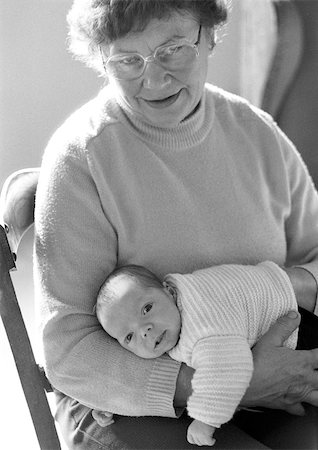 Mature woman holding baby, b&w Stock Photo - Premium Royalty-Free, Code: 696-03398679