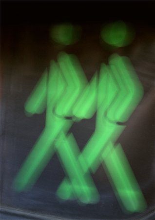 protection pictogram - Green pedestrian crossing light, close-up Stock Photo - Premium Royalty-Free, Code: 696-03398794