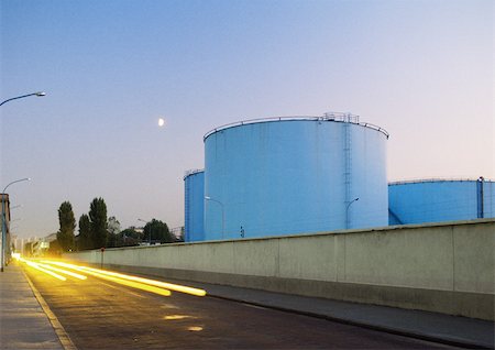 simsearch:695-03382978,k - Storage tanks next to road with car light trails Stock Photo - Premium Royalty-Free, Code: 696-03398987
