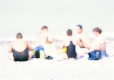 simsearch:696-03399615,k - Group of people sitting on sand at the beach, blurred Stock Photo - Premium Royalty-Free, Code: 696-03399619