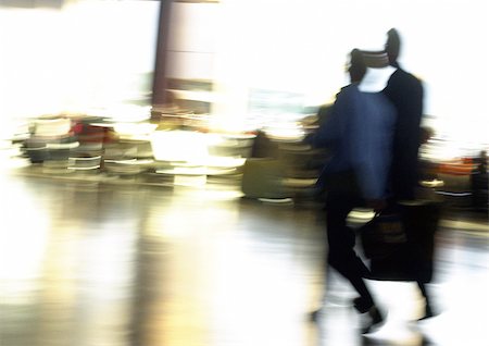 simsearch:695-03386286,k - People in airport, blurred Stock Photo - Premium Royalty-Free, Code: 696-03399661