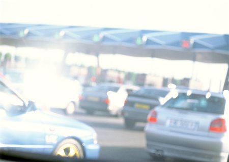 Cars waiting at toll booth, blurred Stock Photo - Premium Royalty-Free, Code: 696-03399674