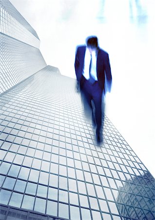 suicide - Businessman walking on side of skyscraper, montage Stock Photo - Premium Royalty-Free, Code: 696-03399682