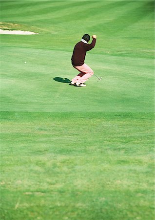 simsearch:862-03889244,k - Golfeur rendant le poing en signe de victoire Photographie de stock - Premium Libres de Droits, Code: 696-03400057