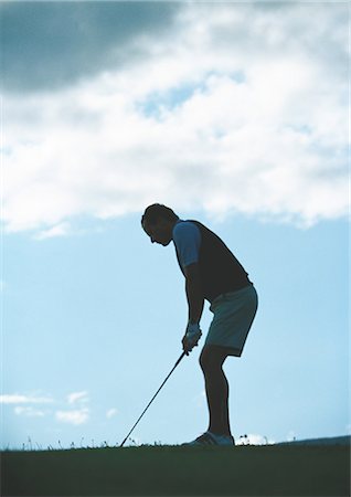 simsearch:862-03889244,k - Golfeur prépare à swing, rétro-éclairé Photographie de stock - Premium Libres de Droits, Code: 696-03400068