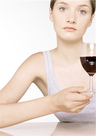 simsearch:640-02770391,k - Young woman with glass of wine Stock Photo - Premium Royalty-Free, Code: 696-03400156