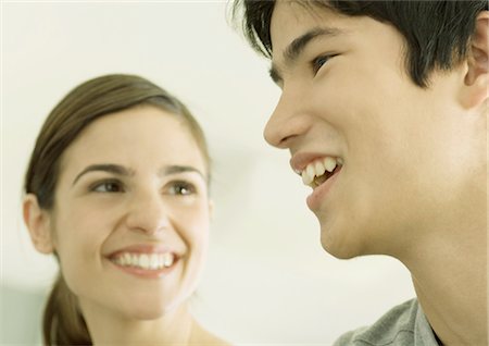 simsearch:695-03382482,k - Young couple smiling Stock Photo - Premium Royalty-Free, Code: 696-03400463
