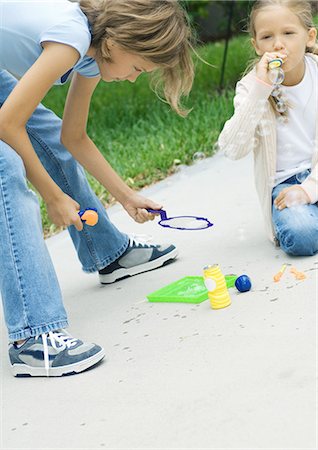 simsearch:632-05604245,k - Girls blowing bubbles Stock Photo - Premium Royalty-Free, Code: 696-03400778