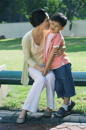 simsearch:632-05816381,k - Mother kissing son on cheek Stock Photo - Premium Royalty-Free, Code: 696-03401218