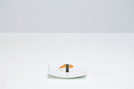 Goldfish prepared as nigiri sushi placed alone on sushi plate Stock Photo - Premium Royalty-Free, Code: 696-03402755
