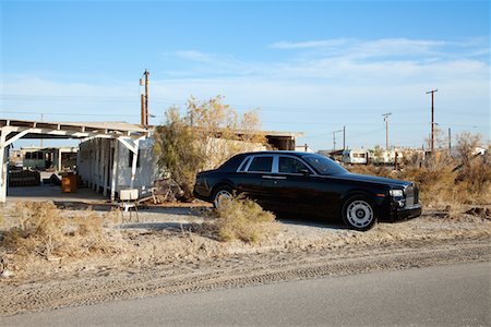 earth no people - Rolls Royce parked on side of road near abandoned houses Stock Photo - Premium Royalty-Free, Code: 693-05552700