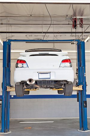 service station photography - Cars on hoist at repair shop Stock Photo - Premium Royalty-Free, Code: 693-05794039