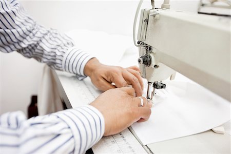 sewn - cropped image of tailor sewing cloth on sewing machine Stock Photo - Premium Royalty-Free, Code: 693-05794549