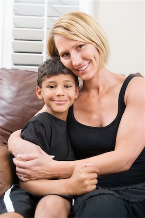 Mother cuddling her son Stock Photo - Premium Royalty-Free, Code: 693-05793969