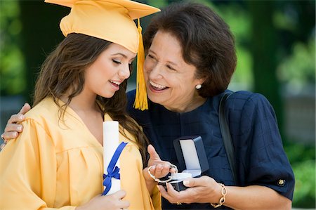 simsearch:693-06014177,k - Graduate Receiving bracelet from Grandmother outside Stock Photo - Premium Royalty-Free, Code: 693-06014162