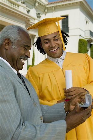 simsearch:693-06014177,k - Graduate receiving present from father outside university Stock Photo - Premium Royalty-Free, Code: 693-06014197