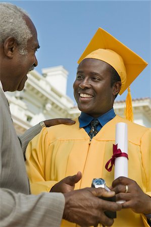 simsearch:693-06014177,k - Graduate receiving present from father outside university Stock Photo - Premium Royalty-Free, Code: 693-06014198