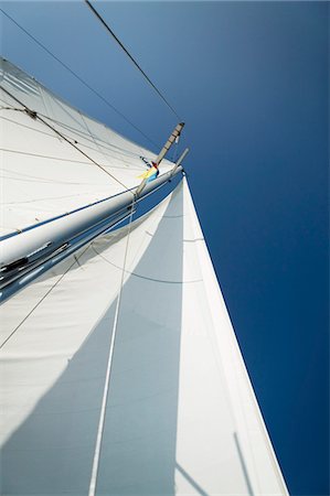 simsearch:614-00602699,k - Sailboat mast and sail, (low angle view) Stock Photo - Premium Royalty-Free, Code: 693-06014370