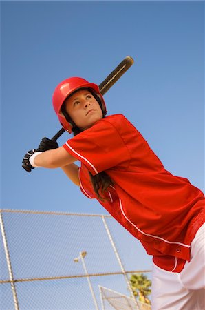 softball - Softball player at bat, portrait, low angle view Stock Photo - Premium Royalty-Free, Code: 693-06014492