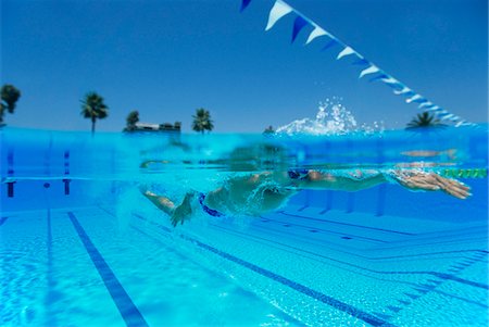 Man Swimming in Pool Stock Photo - Premium Royalty-Free, Code: 693-06014667