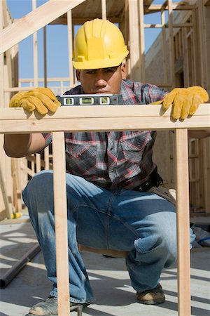 simsearch:693-06016727,k - Construction worker using spirit level on building Stock Photo - Premium Royalty-Free, Code: 693-06016706