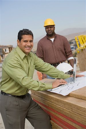 simsearch:693-06016727,k - Construction worker using laptop, portrait Stock Photo - Premium Royalty-Free, Code: 693-06016716