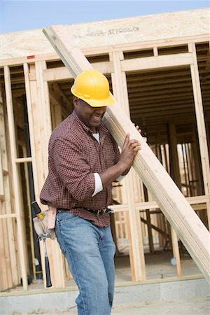 simsearch:693-06016727,k - Construction worker carrying wooden plank Stock Photo - Premium Royalty-Free, Code: 693-06016720