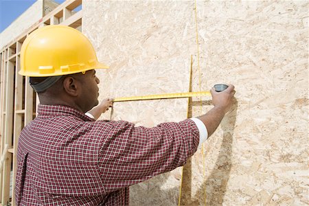 simsearch:693-06016727,k - Construction worker measuring building Stock Photo - Premium Royalty-Free, Code: 693-06016735