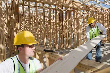 simsearch:693-06016727,k - Two construction workers measuring wooden plank Stock Photo - Premium Royalty-Free, Code: 693-06016745