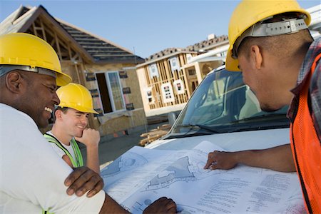 simsearch:693-06016727,k - Three construction workers studying blueprint Stock Photo - Premium Royalty-Free, Code: 693-06016751