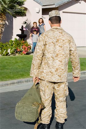 soldier with family - Soldier returning home to family Stock Photo - Premium Royalty-Free, Code: 693-06018181