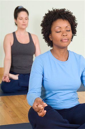 simsearch:693-06018275,k - Women Meditating in Yoga Class Stock Photo - Premium Royalty-Free, Code: 693-06018263