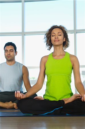 simsearch:693-06018275,k - People Meditating During Yoga Class Stock Photo - Premium Royalty-Free, Code: 693-06018316