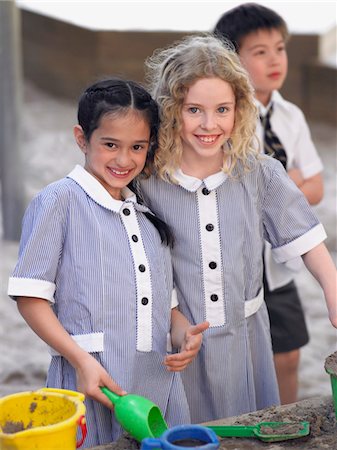 elementary school recess - Two school girls playing in playground, portrait Stock Photo - Premium Royalty-Free, Code: 693-06018560