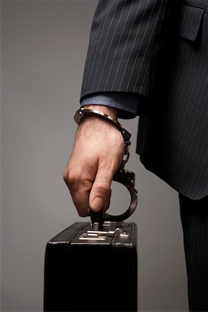 enigma - Briefcase Handcuffed to Businessman's Wrist Stock Photo - Premium Royalty-Free, Code: 693-06018958