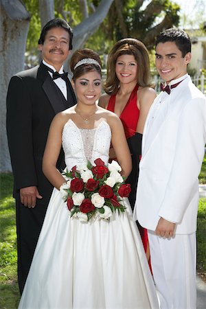 quinceanera - Portrait of couple (13-15) with parents at Quinceanera Stock Photo - Premium Royalty-Free, Code: 693-06019473