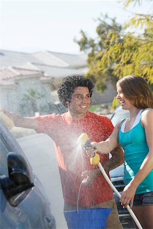 Young couple washing car Stock Photo - Premium Royalty-Free, Code: 693-06019586