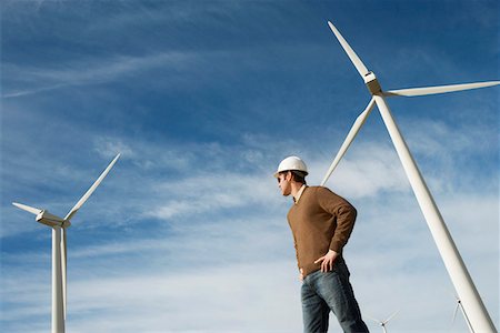 Engineer wearing hardhat at wind farm Stock Photo - Premium Royalty-Free, Code: 693-06019777