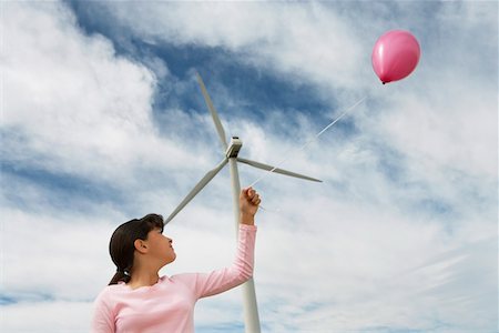 simsearch:614-07768068,k - Girl (7-9) playing with balloon at wind farm Stock Photo - Premium Royalty-Free, Code: 693-06019784