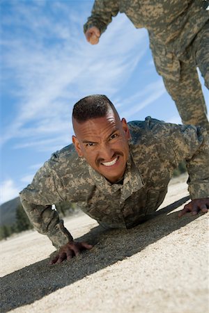 Portrait of soldier doing pushups Stock Photo - Premium Royalty-Free, Code: 693-06019819
