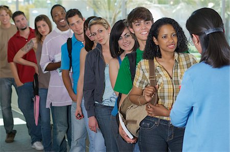 Row of students and teacher in school Stock Photo - Premium Royalty-Free, Code: 693-06019896