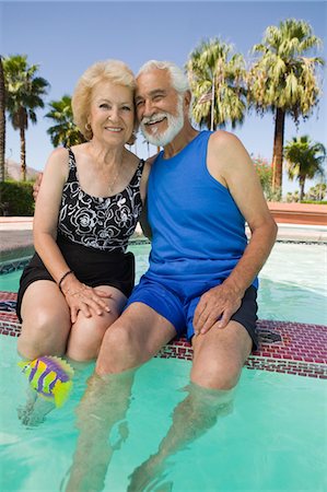 elderly women in bathing suits& - Senior Couple sitting on edge of swimming pool, portrait. Stock Photo - Premium Royalty-Free, Code: 693-06013581