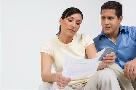 simsearch:693-06021323,k - Couple Looking at Credit Card Bill Stock Photo - Premium Royalty-Free, Code: 693-06020057