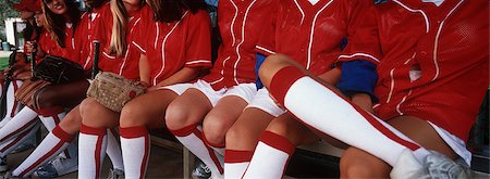 Teenage (13-17) baseball team sitting on bench, mid section Stock Photo - Premium Royalty-Free, Code: 693-06020104