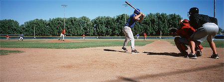 playing baseball - Joueurs de baseball sur le terrain de jeu Photographie de stock - Premium Libres de Droits, Code: 693-06020117