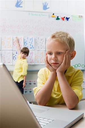 student room - Schoolboy Using a Laptop Stock Photo - Premium Royalty-Free, Code: 693-06020615