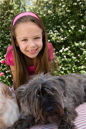 Little Girl with Pets Foto de stock - Sin royalties Premium, Código: 693-06020638